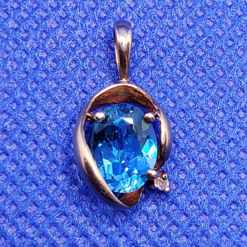 Genuine blue topaz/diamond accent pendant